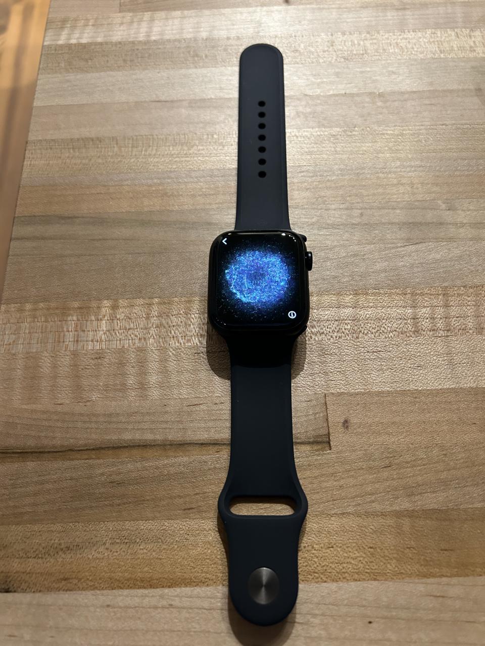 apple watch series 8 with black band and black and blue screen