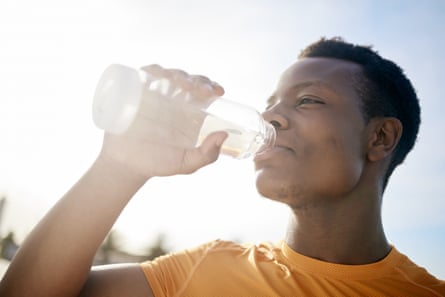 Man drinking water after exercise